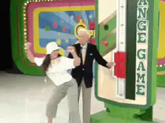 Woman dances with Bob Barker on The Price is Right