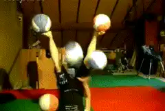 person juggling five balls