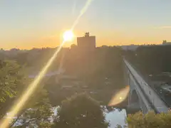 Sunset over a bridge and city