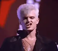 Boy George singing passionately