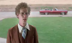 Biff Tannen's red convertible drives by