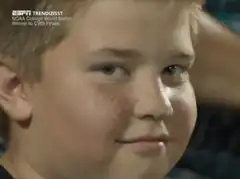 Young boy smirking at camera