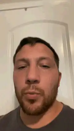 Man rolls eyes and looks away