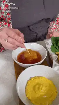 Dipping chicken nugget in sauce