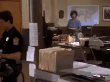 The Terminator walks through the police station