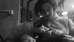man smiling with cat on face