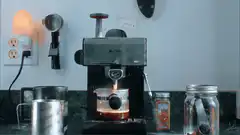Espresso machine pouring coffee