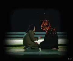 Woman watching person dissolve into sparks