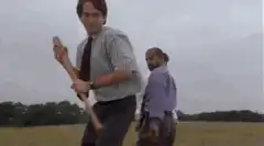Man smashing printer with bat