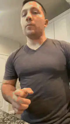 Man pointing and checking watch