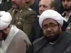 Man in white turban crying