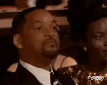 Will Smith yawning at an event