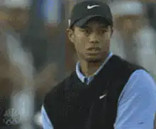 Tiger Woods smirking and nodding