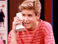 Macaulay Culkin talking on a cordless phone
