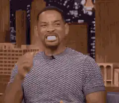 Will Smith making a mustache with his hands