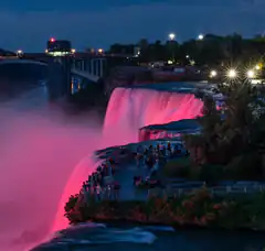Niagara Falls illuminated in pink at night