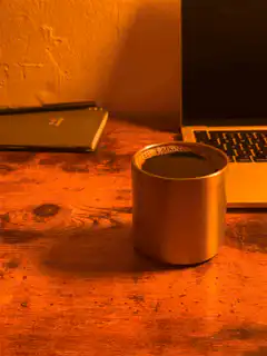 steaming coffee cup on desk