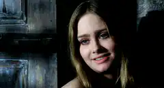 Amanda Bynes smiling and fading to black