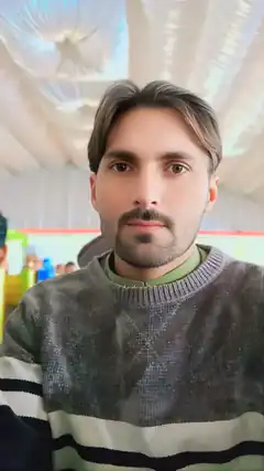 Man in striped sweater looking at camera