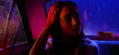 Woman in car with neon lights