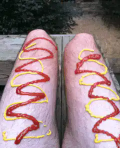 Legs covered in ketchup and mustard