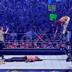 Wrestler performs a diving headbutt