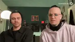 Two men with math equations floating around