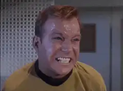 James T. Kirk grimacing and laughing