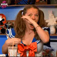 Woman in sailor outfit yawns widely