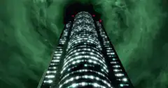 Man levitating near skyscraper