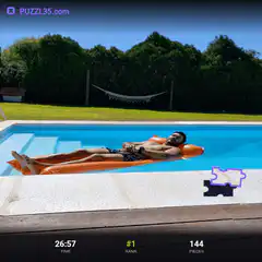 Man relaxing on pool float with puzzle piece