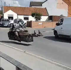 Mandalorian flying speeder on street