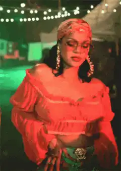 Rihanna singing in red outfit