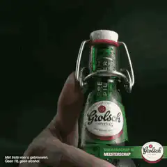 Grolsch beer bottle pops open