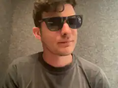 Man in sunglasses smirking