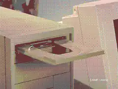 hand inserting cd into computer