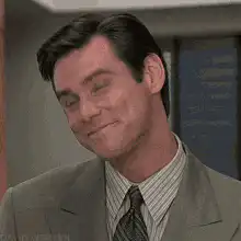 Jim Carrey smirking and looking up