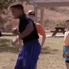 Dancing boy in blue shorts