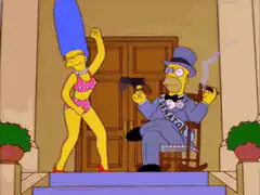 Marge dances while Mayor Quimby fires a gun