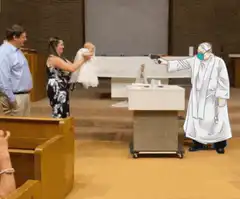 Doctor shoots laser at baby