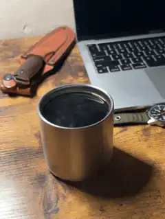 Steam rising from a metal cup