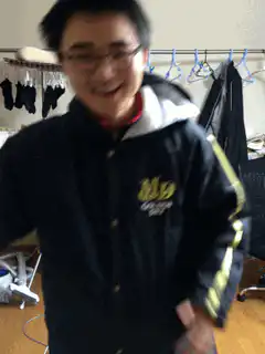 Man in jacket dancing excitedly