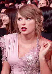 Taylor Swift looking around confused