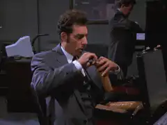 Michael Richards eats a hot dog