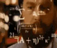 Man staring intensely at math equations
