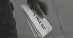 Hand holding condom with text