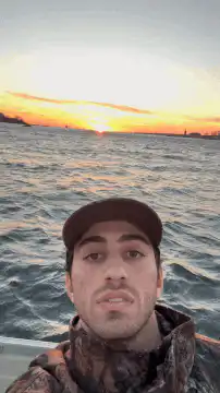 Man on boat at sunset
