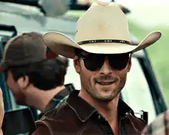 Cowboy tipping hat