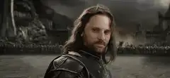 Theoden kneels to Aragorn