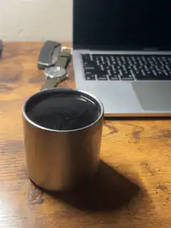 Coffee cup on desk with laptop
